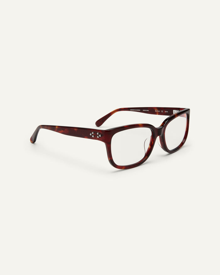 Side shot of Bonnie Clyde Guts optical frames in red tortoise with clear lenses.