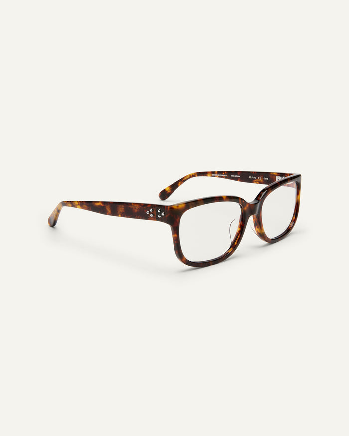 Side shot of Bonnie Clyde Guts optical frames in tortoise with clear lenses.