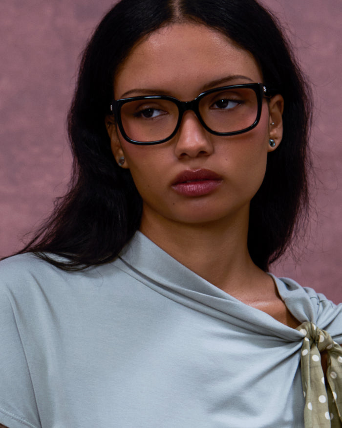 Close-up shot of Bonnie Clyde Guts optical frames in black with clear lenses.
