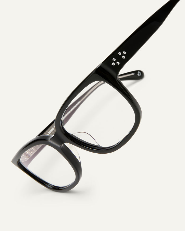 Detail shot of Bonnie Clyde Guts optical frames in black with clear lenses.