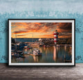 a serene harbor scene at sunset, with boats docked in the calm waters and a lighthouse standing tall in the background.
