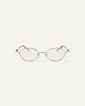 Face shot of Bonnie Clyde Heirloom optical frames in silver and tortoise with clear lenses.