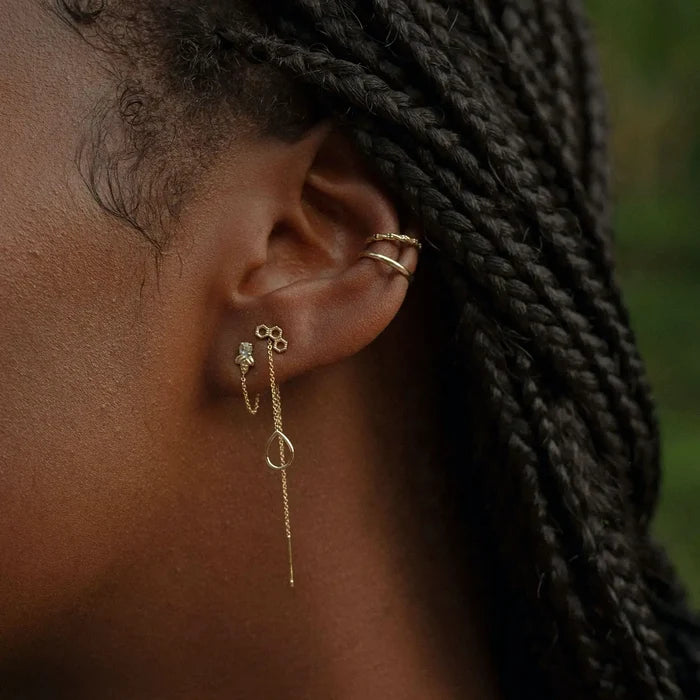 Honeycomb Earring in 14k yellow gold, shown worn on hand
