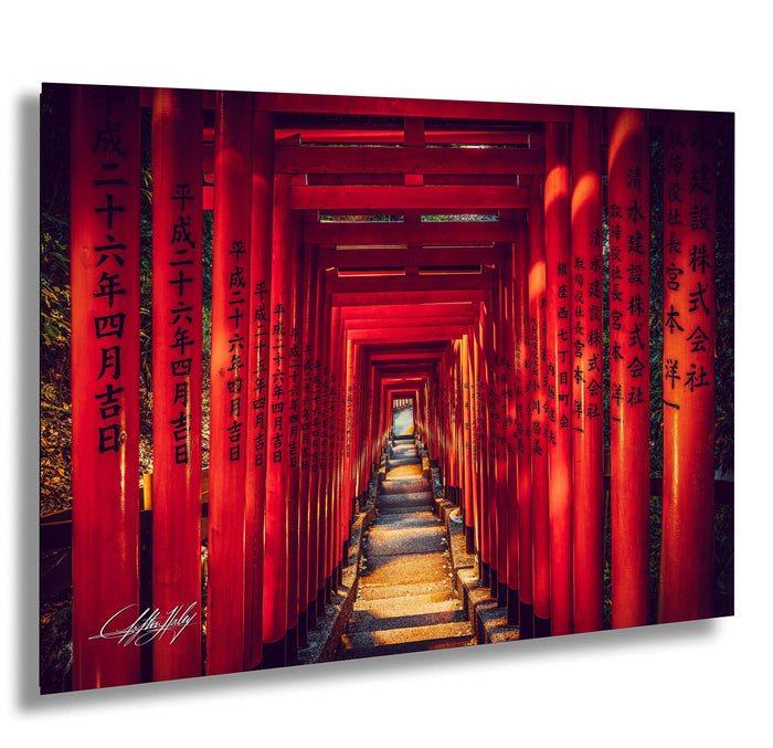 A long, narrow path lined with red torii gates leading to a bright light at the end, creating a striking and visually captivating scene.