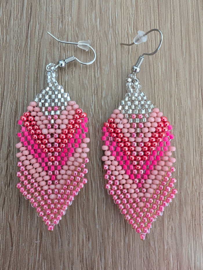 Pink beaded feather earrings