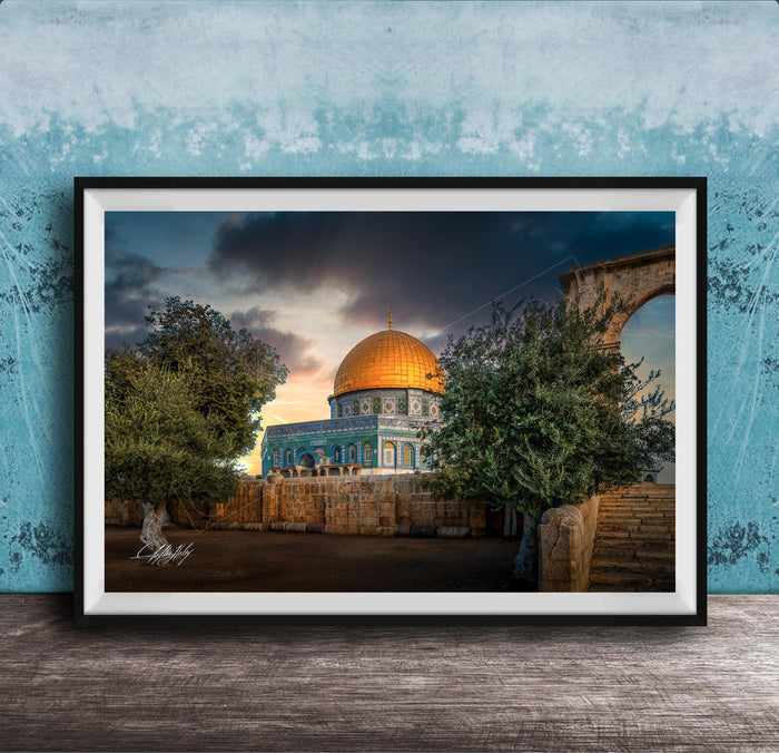 a large, ornate dome with a golden roof, surrounded by trees and a stone wall, set against a dramatic sky with clouds.