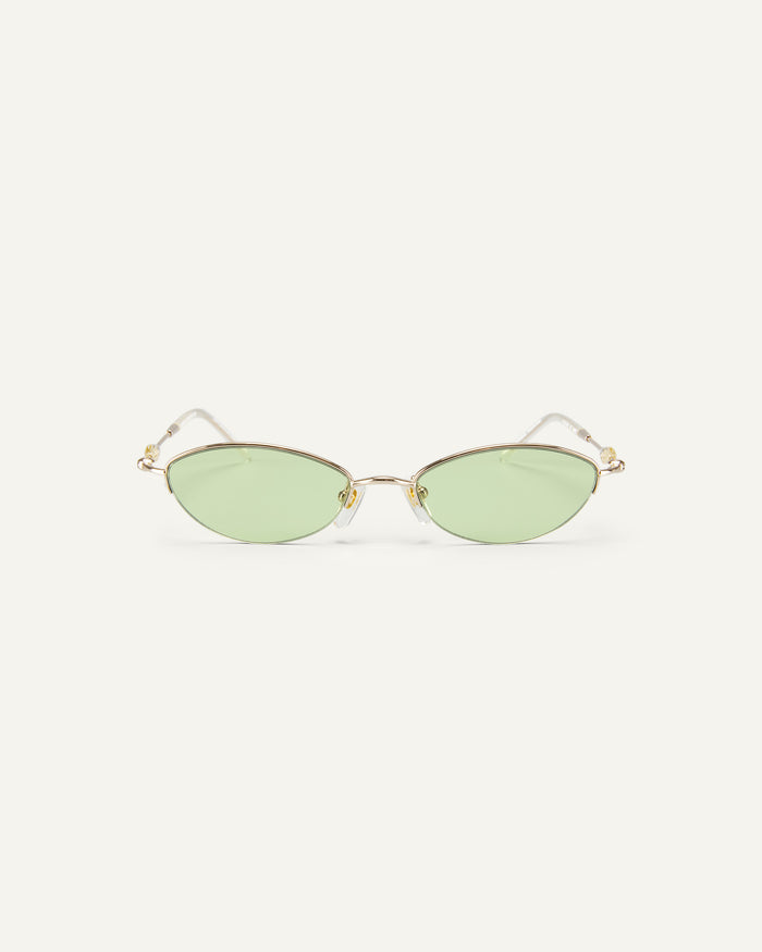 Face shot of Bonnie Clyde Jewel sunglasses in gold with green lenses.