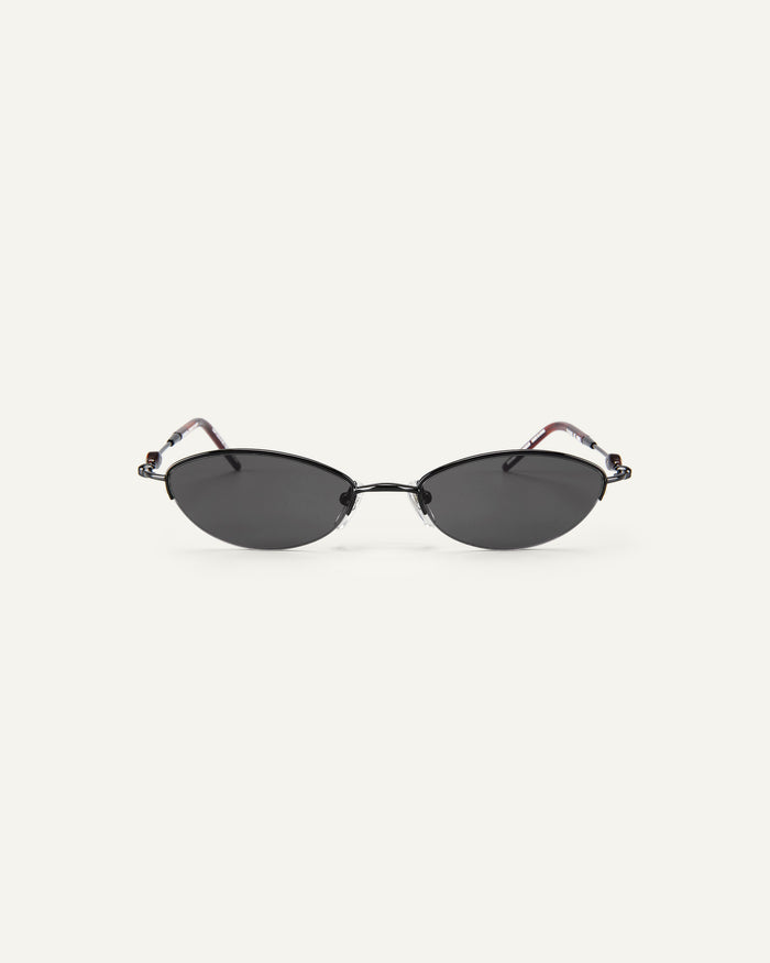 Face shot of Bonnie Clyde Jewel sunglasses in black with black lenses.