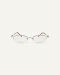 Face shot of Bonnie Clyde Jewel optical frames in silver and tortoise with clear lenses.