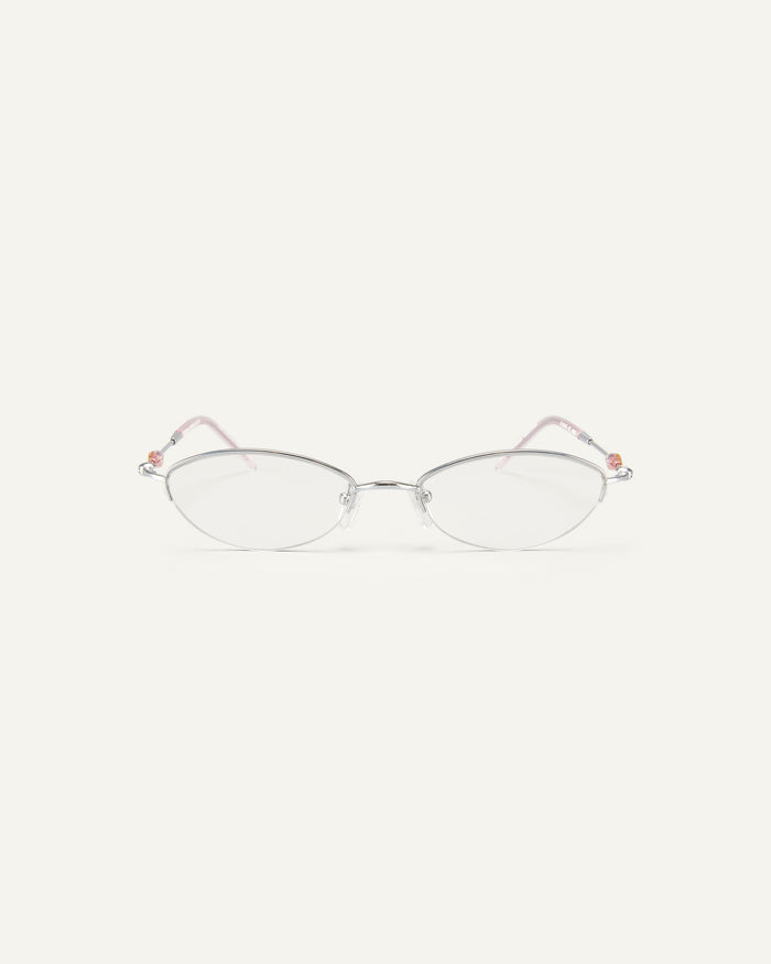 Face shot of Bonnie Clyde Jewel optical frames in silver with clear lenses.