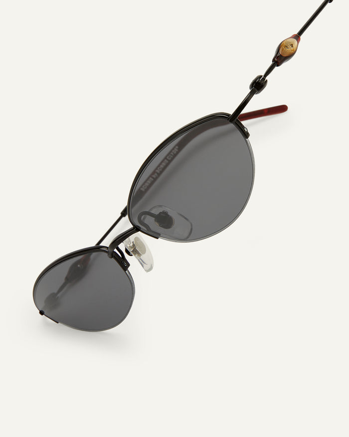 Side shot of Bonnie Clyde Jewel sunglasses in black with black lenses.