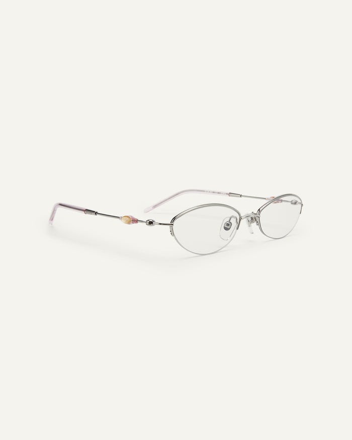 Side shot of Bonnie Clyde Jewel optical frames in silver with clear lenses.