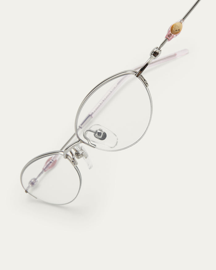 Close-up shot of Bonnie Clyde Jewel optical frames in silver with clear lenses.