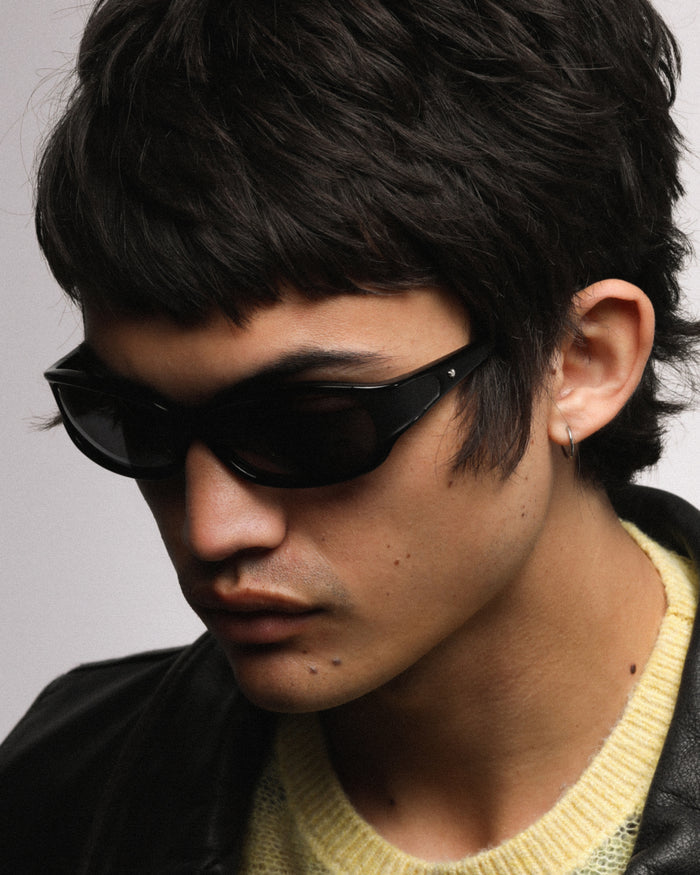 Quarter shot of Bonnie Clyde Joans sunglasses in black with black lenses.