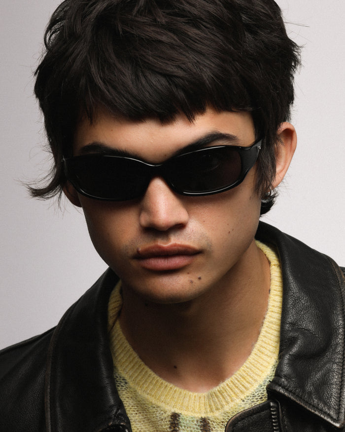 Close-up shot of Bonnie Clyde Joans sunglasses in black with black lenses.