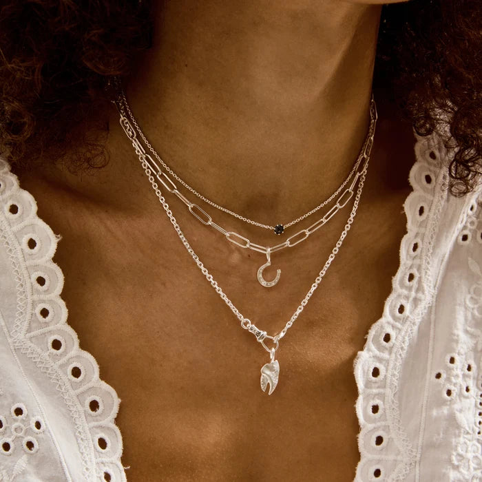 closeup of someone wearing kindred love lobster necklace charm