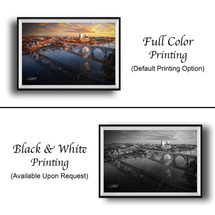 The image is a collage of two framed pictures. The top picture is a full color print of a cityscape with a bridge, while the bottom picture is a black and white print of the same cityscape. Both pictures are framed and available upon request.
