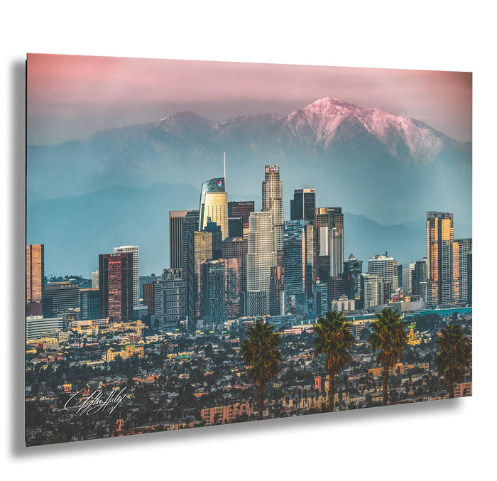 A panoramic view of the Los Angeles skyline, with the city's iconic skyscrapers and mountains in the background.