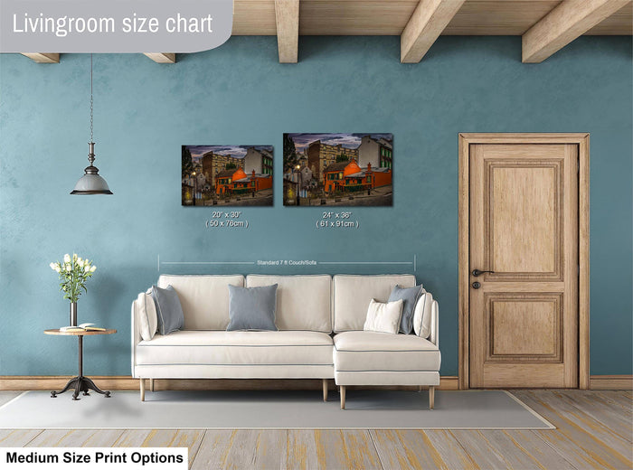 a living room with a white sofa, a wooden door, and a painting of a cityscape on the wall. The painting is of medium size, and the sofa is of standard size. The living room appears to be well-decorated with a potted plant and a vase on a side table.