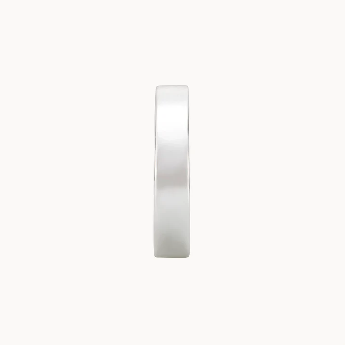 The legacy ring silver from bluboho, crafted from sterling silver, is displayed from a top view lying flat against a white background. Its minimalist design boasts a smooth, polished finish and a perfectly rounded shape, creating an elegant and simple aesthetic.
