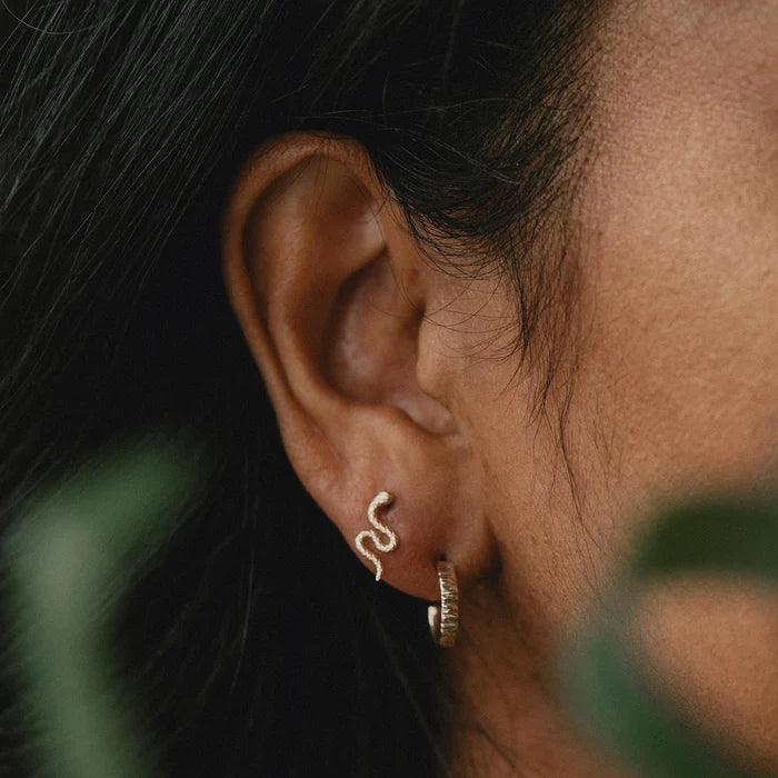Little Tree Bark Stability Hoop in 14k yellow gold, shown worn on hand