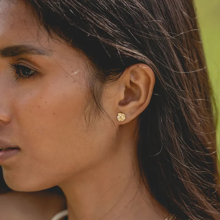 Little Wildflower Earring in 14k yellow gold, shown worn on hand