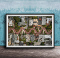 The image is an aerial view of a winding road in a residential area, with houses and trees lining the road.
