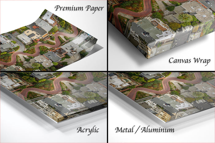 The image is a collage of four different views of a city street, each with a distinct perspective and style. The first view is a top-down aerial perspective, the second view is a close-up of the street, the third view is a close-up of the street, and the fourth view is a close-up of the street. The images are labeled as "Premium Paper", "Canvas Wrap", "Acrylic", and "Metal/Aluminum".