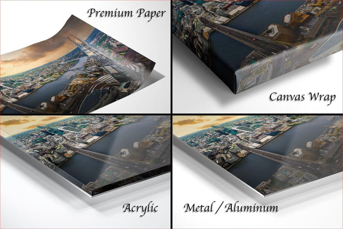 The image is a collage of four different views of a cityscape, each with a distinct perspective and angle. The collage includes a close-up view of the city's skyline, a panoramic view of the city, a side view of the city, and a top-down view of the city. The collage is labeled as "Premium Paper", "Canvas Wrap", "Acrylic", and "Metal/Aluminum" to describe the materials used in the artwork.