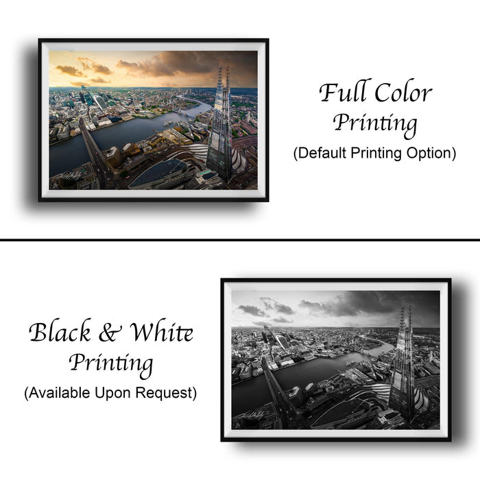 The image is a collage of two framed photographs. The top photograph is a full color print of a cityscape, while the bottom photograph is a black and white print of the same cityscape. Both photographs are framed and available upon request.