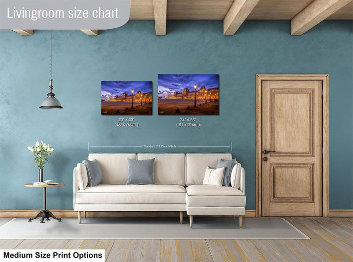 a living room with a white sofa and a wooden door. Above the sofa, there is a livingroom size chart that provides the dimensions of the two framed pictures hanging on the wall.