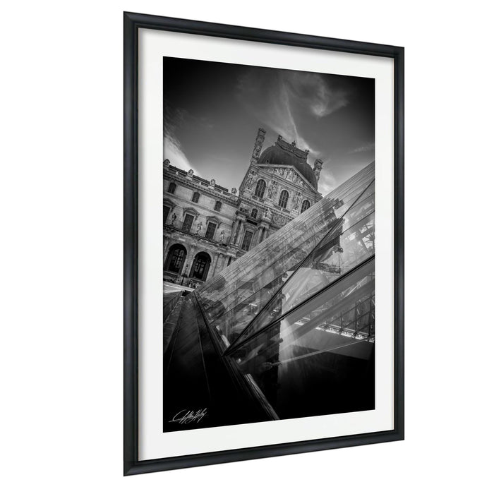 A black and white photograph of a historic building with a dome, framed in a black frame and hanging on a wall.