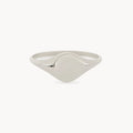 This is the Loyalty signet ring by bluboho, an elegant sterling silver piece with a smooth, polished surface. Its circular face is left blank, perfect for engraving, and the narrow band curves gently to meet the face against a plain white background.