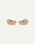 Face shot of Bonnie Clyde Lucky Star sunglasses in gold with brown lenses.
