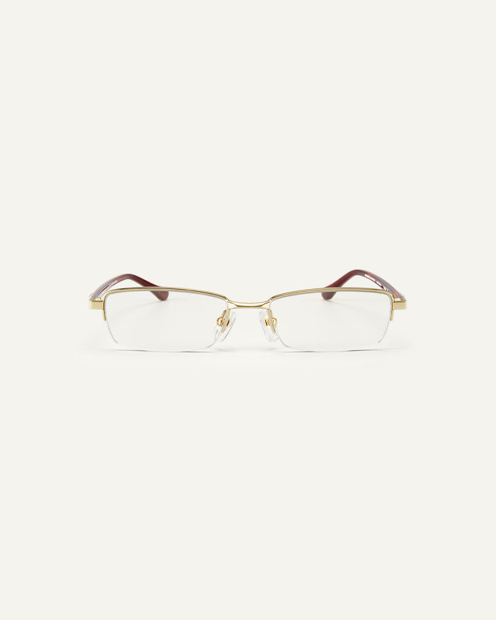 Face shot of Bonnie Clyde Lucky Star optical frames in gold with clear lenses.