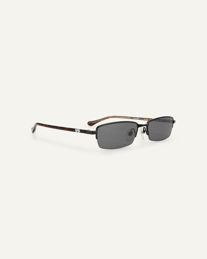 Quarter shot of Bonnie Clyde Lucky Star sunglasses in black with black lenses.