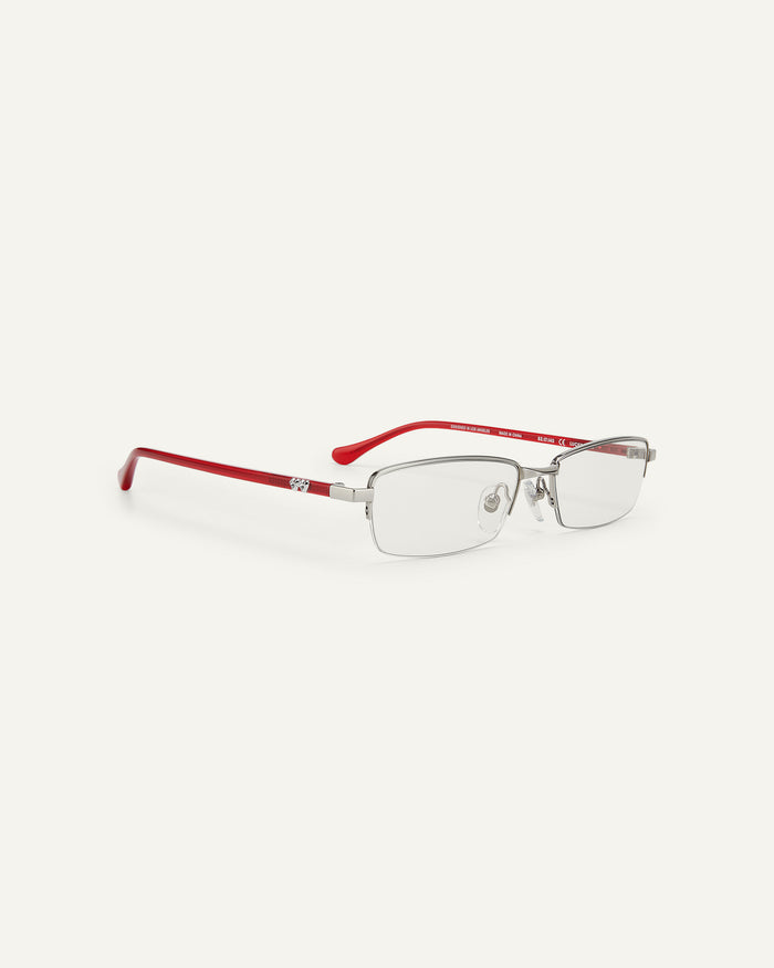 Quarter shot of Bonnie Clyde Lucky Star optical frames in silver with clear lenses.