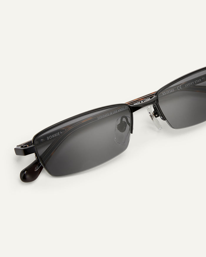 Side shot of Bonnie Clyde Lucky Star sunglasses in black with black lenses.
