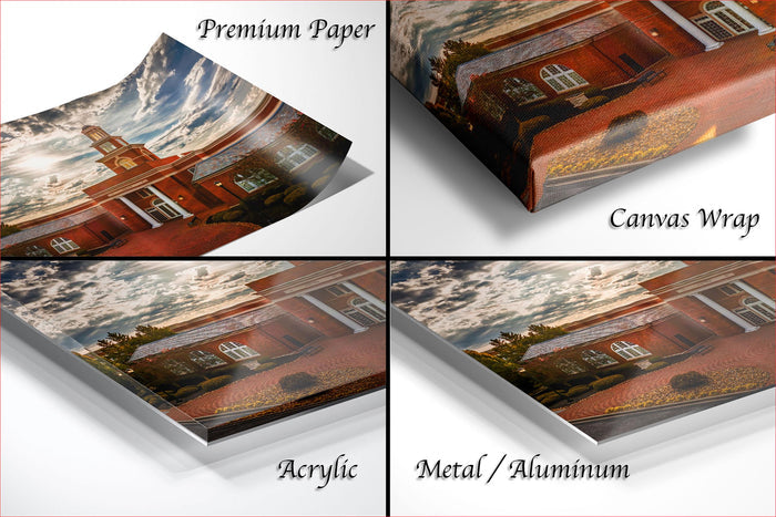 The image is a collage of four photos depicting a brick building with a clock tower, each with different text labels indicating the type of material used: "Premium Paper", "Canvas Wrap", "Acrylic", and "Metal/Aluminum".
