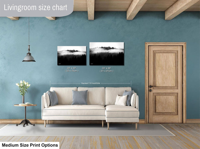 a living room with a white sofa, a wooden door, and a painting of a landscape on the wall. The living room appears to be designed for relaxation and comfort, with a focus on the artwork and the overall aesthetic.