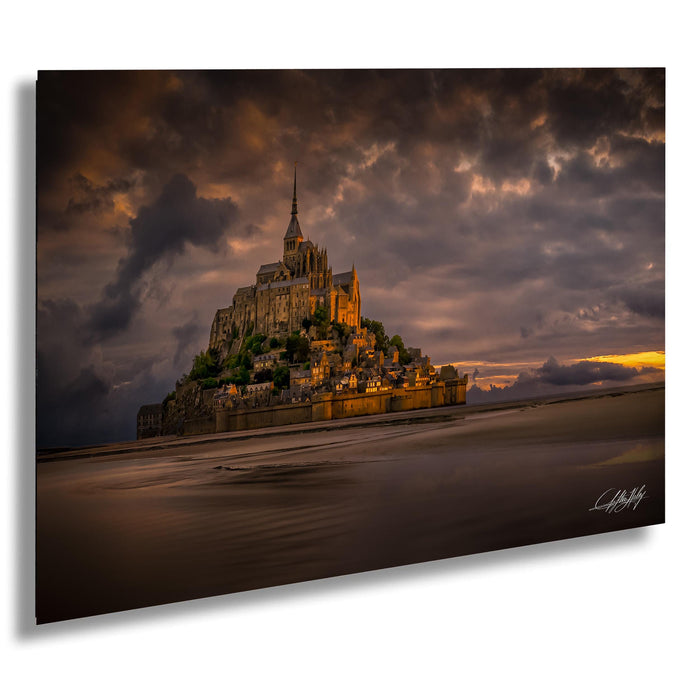 a large, multi-leveled castle or fortress situated on a hill, with a dramatic sky in the background.