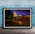 a picturesque night scene featuring a large, illuminated cathedral or church in the background, with a winding path leading up to it. The cathedral is surrounded by trees and illuminated by warm lighting, creating a serene and peaceful atmosphere.