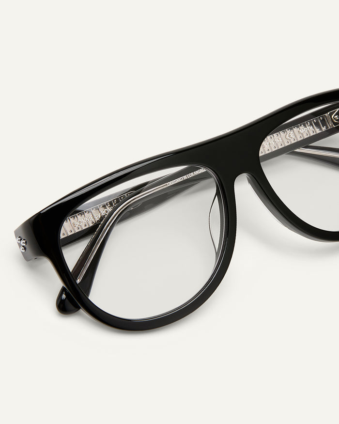 Close-up shot of Bonnie Clyde Moth optical frames in black with clear lenses.