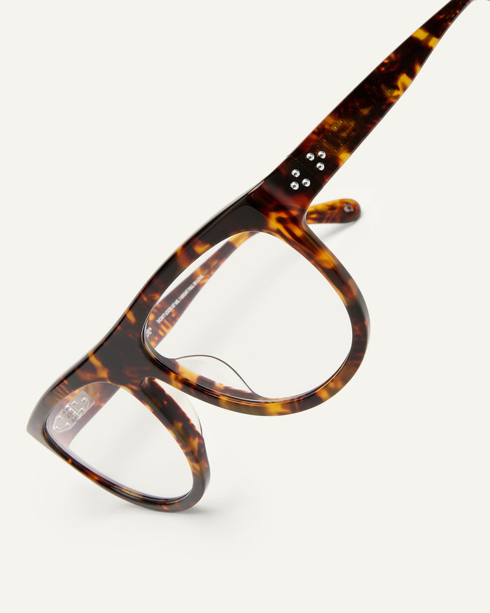 Detail shot of Bonnie Clyde Moth optical frames in tortoise with clear lenses.