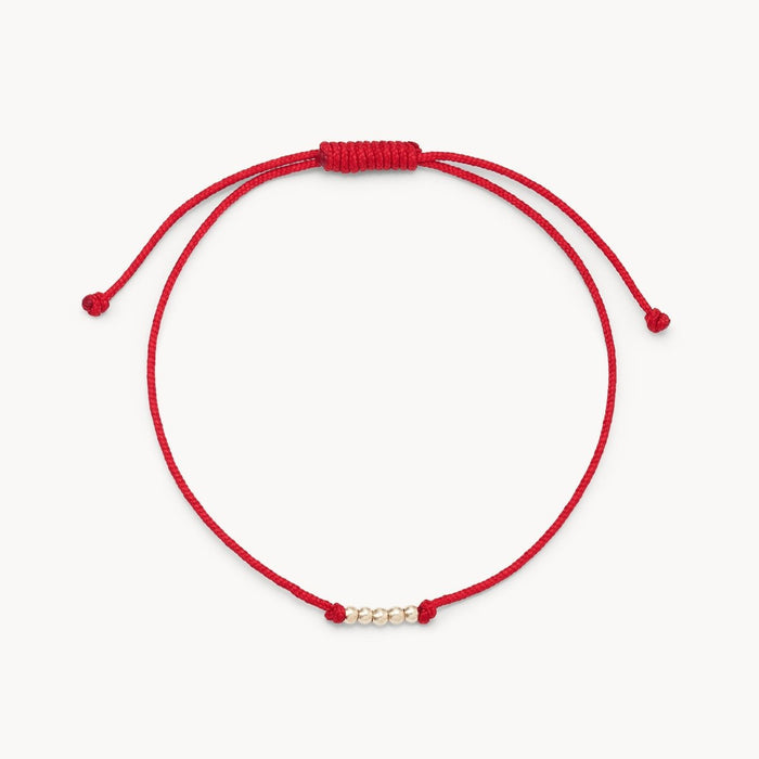 New the Abacus Contemplation Cord Bracelet in 10k yellow gold with red cord