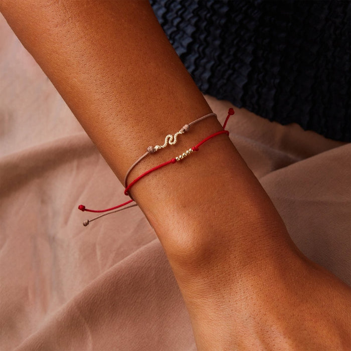 New the Abacus Contemplation Cord Bracelet in 10k yellow gold with red cord, alternate angle detail view