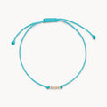 New the Abacus Contemplation Cord Bracelet in 10k yellow gold with teal cord