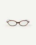 Face shot of Bonnie Clyde Nisa optical frames in silver and layered teal demi with clear lenses.