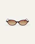 Face shot of Bonnie Clyde Nisa sunglasses in black and red tortoise with brown gradient lenses.