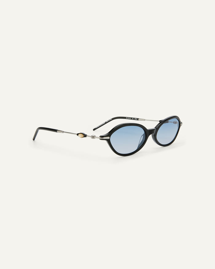 Side shot of Bonnie Clyde Nisa sunglasses in black with blue gradient lenses.